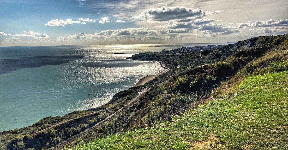 The coastline curving toward Folkestone, seen from the cliff path